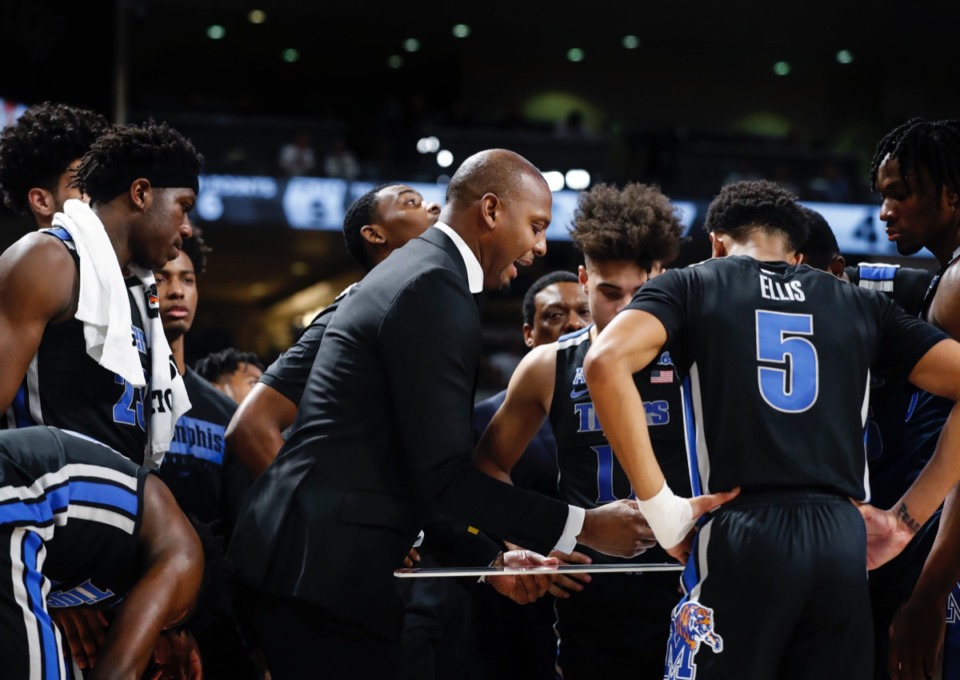 <strong>Memphis head coach Penny Hardaway (middle) directs his team during a timeout against UCF on Wednesday, Jan. 29, 2020, in Orlando.</strong> (Mark Weber/Daily Memphian)