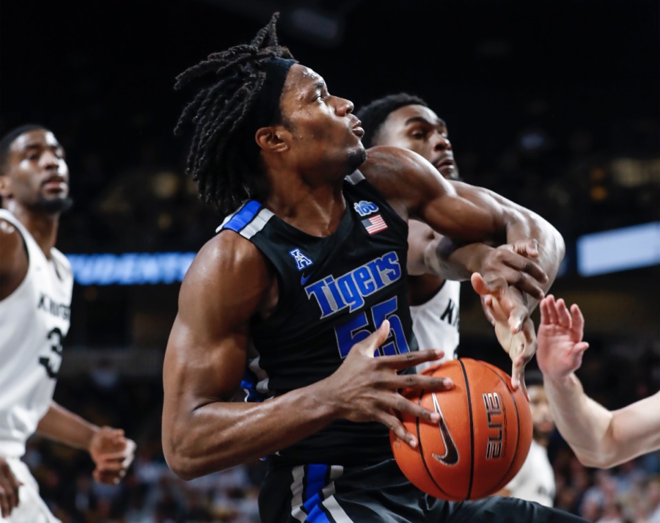 <strong>Memphis forward Precious Achiuwa (left) drives the lane against the UCF defense during action on Wednesday, Jan. 29, 2020, in Orlando.</strong> (Mark Weber/Daily Memphian)
