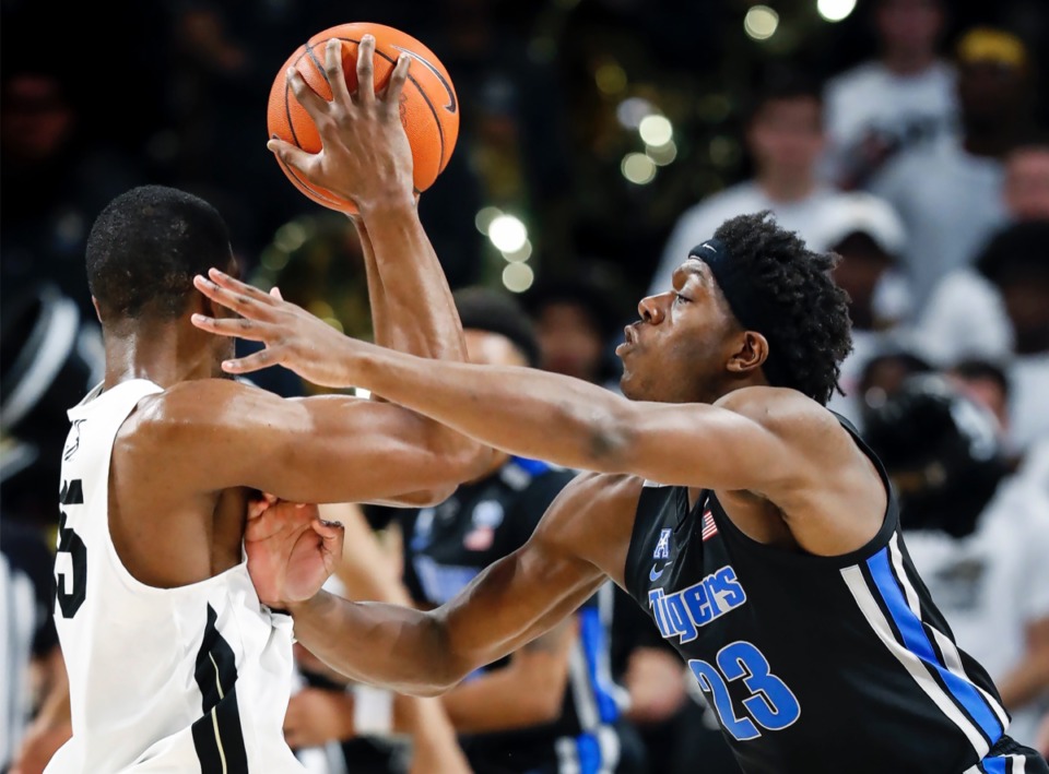 <strong>Memphis defender Malcolm Dandridge (right) applies pressure to UCF forward Collin Smith (left) during action on Wednesday, Jan. 29, 2020, in Orlando.</strong> (Mark Weber/Daily Memphian)