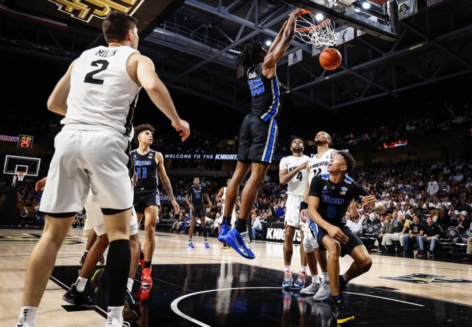 <strong>Memphis forward Precious Achiuwa (middle) goes up for a dunk over the UCF defense during action on Wednesday, Jan. 29, 2020, in Orlando.</strong> (Mark Weber/Daily Memphian)