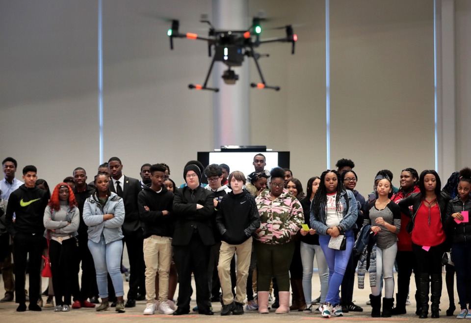 <strong>During an IT career day for Shelby County Schools at the FedEx Experience Center, students watch the launch of a drone used to inspect planes. The Jan. 30, 2020, event featured presentations on logistics technology and the company's drone delivery program.</strong> (Jim Weber/Daily Memphian)