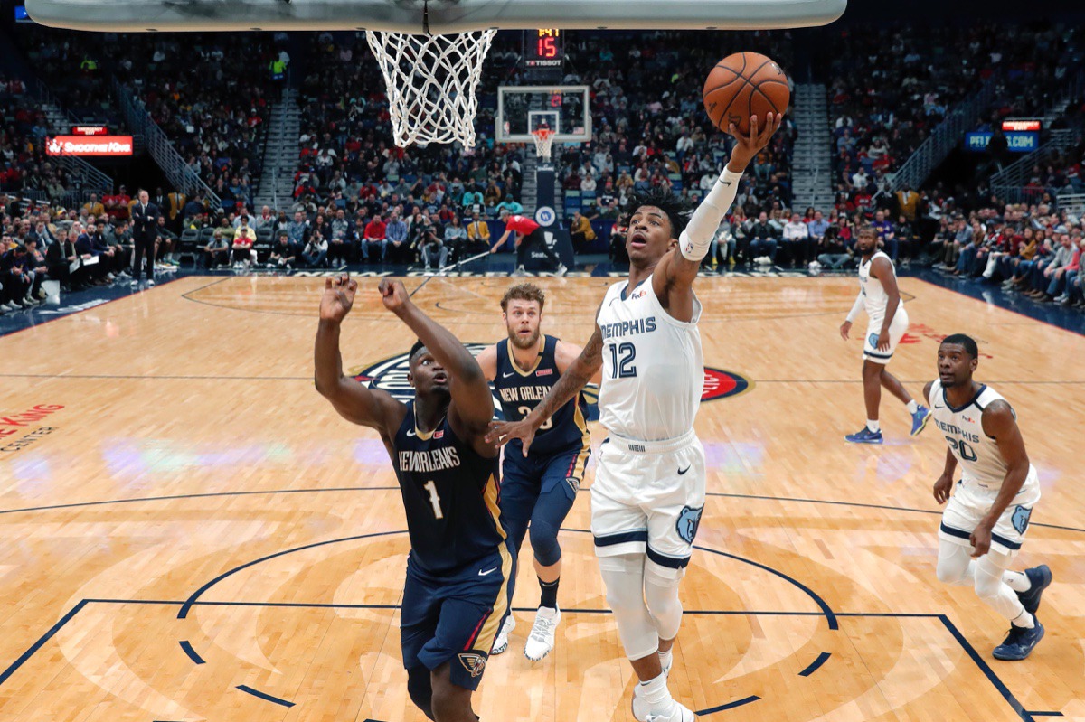<strong>Memphis Grizzlies guard Ja Morant (12) goes to the basket against New Orleans Pelicans forward Zion Williamson (1) during the first half of an NBA basketball game in New Orleans, Friday, Jan. 31, 2020.</strong> (Gerald Herbert/AP)