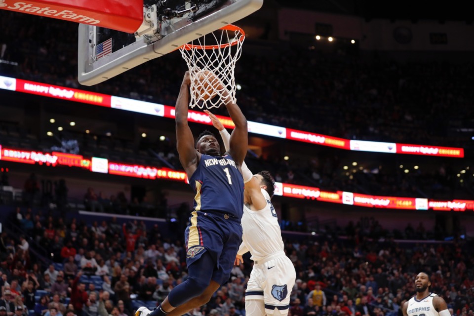<strong>New Orleans Pelicans forward Zion Williamson (1) goes to the basket against Memphis Grizzlies guard Dillon Brooks in New Orleans, Friday, Jan. 31, 2020.</strong> (Gerald Herbert/AP)