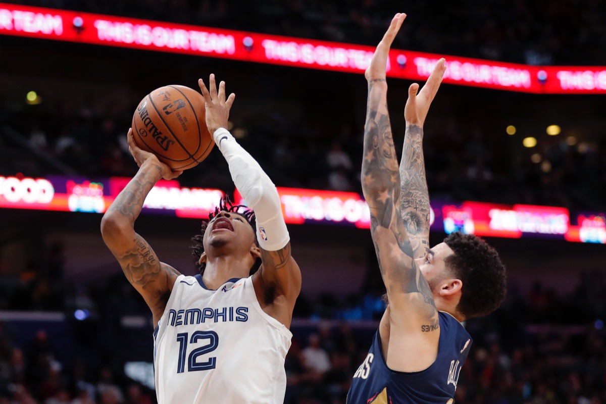 <strong>Memphis Grizzlies guard Ja Morant (12) goes to the basket against New Orleans Pelicans guard Lonzo Ball in New Orleans, Friday, Jan. 31, 2020. The Pelicans won 139-111.</strong> (AP Photo/Gerald Herbert)