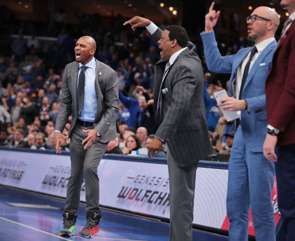 <strong>University of Memphis coaches Penny Hardaway (left), Tony Madlock and Cody Toppert react to a referee's call on the court during the Tigers' game on Feb. 1 2020, against Connecticut at FedExForum in Memphis.</strong> (Jim Weber/Daily Memphian)