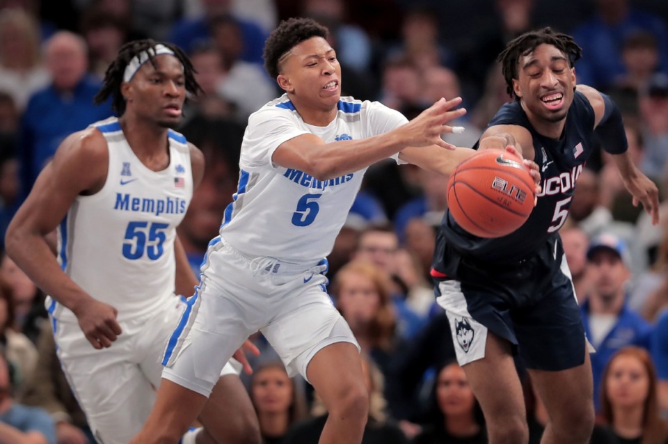 <strong>University of Memphis guard Boogie Ellis (5) stretches for a loose ball under pressure by the Huskies' Isaiah Whaley (right) during the Tigers' game on Feb. 1, 2020, against Connecticut at the FedExForum in Memphis.</strong> (Jim Weber/Daily Memphian)