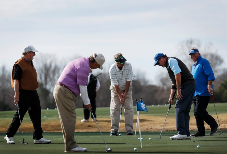 <strong>Golfers work on their putting stroke on the practice green at Colonial Country Club Monday, Feb. 3, 2020.</strong> (Mark Weber/Daily Memphian)