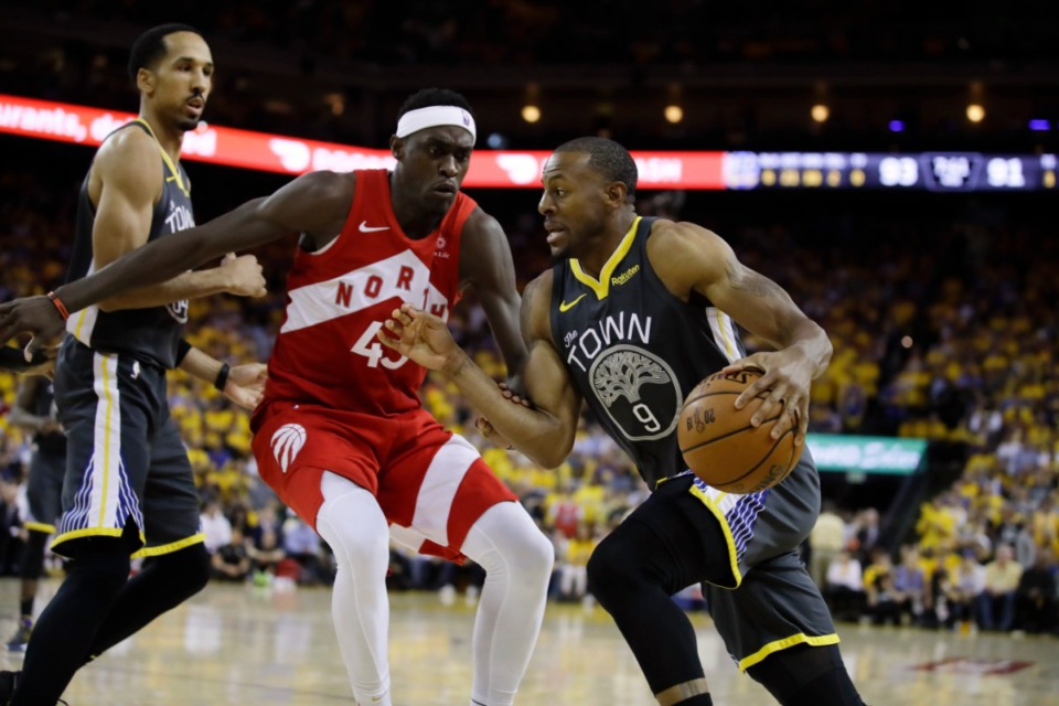 <strong>Golden State Warriors forward Andre Iguodala (9) drives against Toronto Raptors forward Pascal Siakam during the second half of Game 6 of basketball's NBA Finals in Oakland, Calif., in June.</strong> (AP Photo/Ben Margot)