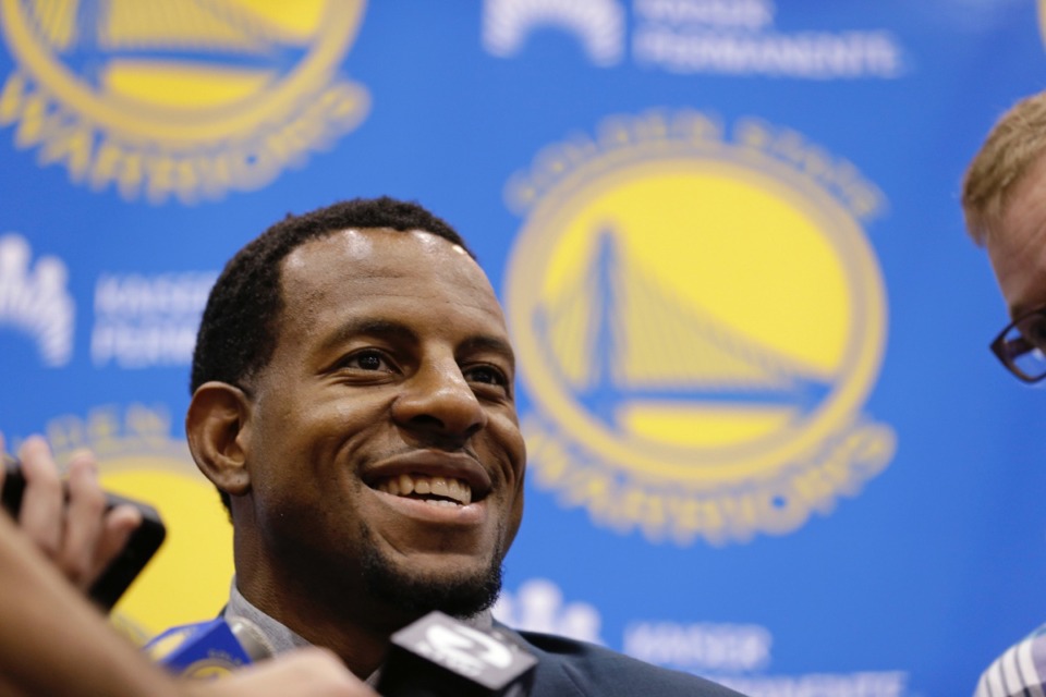 <strong>Andre Iguodala talks with reporters at a press conference July 11, 2013, when he was introduced as a Golden State Warrior. \As a Grizzly, his public appearances have been few.</strong> (Eric Risberg/AP)
