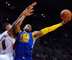 <strong>Andre Iguodala (9) drives to the basket as a Golden State Warrior on April 13, 2014. Now he'll be playing for the Miami Heat, with a non-playing stint in Memphis in between.</strong>&nbsp;(Steve Dykes/AP)