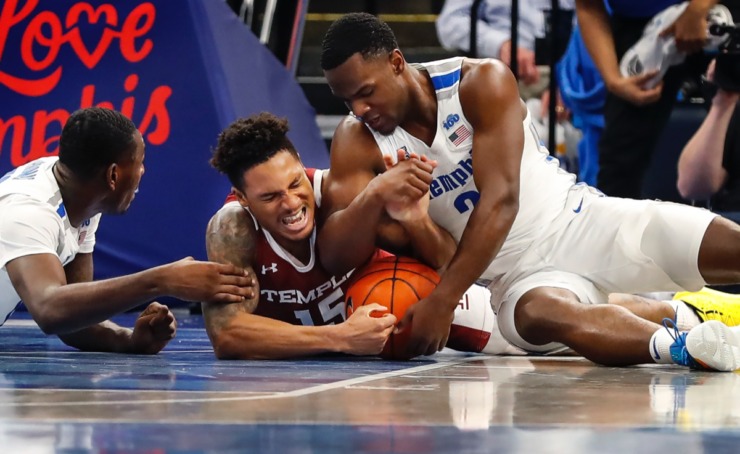 <strong>Memphis defenders Lance Thomas (left) and Alex Lomax (right) battle Temple guard Nate Pierre-Louis for a loose ball Feb. 5, 2020, at FedExForum.</strong> (Mark Weber/Daily Memphian)