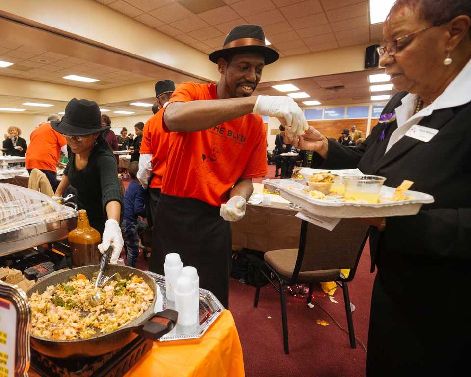 <strong>Avery O'Brian of the Mississippi Boulevard Christian Church men's ministry dishes up samples at Taste of the Boulevard on Sunday, Nov. 11.</strong> (Ziggy Tucker/Special to the Daily Memphian)