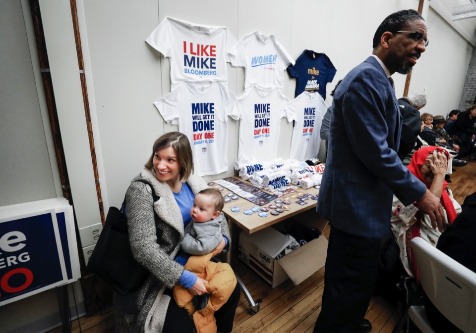 <strong>Helena Powell (left) and her 8-month son Herlio attend the grand opening of Mike Bloomberg&rsquo;s Memphis campaign headquarters at 516 Tennessee St. Thursday, Feb. 6, 2020.</strong> (Mark Weber/Daily Memphian)