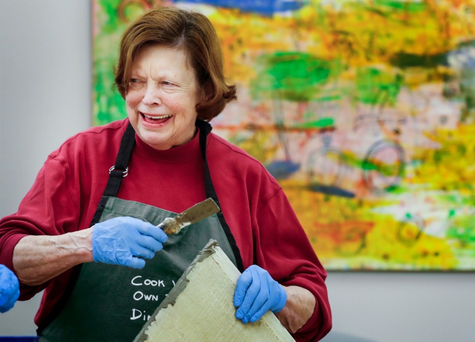 <strong>Amiee Mangum works on adding a plaster boarder while attending a Mosaics for the Garden class for seniors on Feb. 4, 2020, at the Dixon Gallery and Gardens. Creative Aging Mid-South enhances seniors' quality of life by stimulating their minds, creativity and sense of self through arts programs that engage, educate and entertain.</strong> (Mark Weber/Daily Memphian)