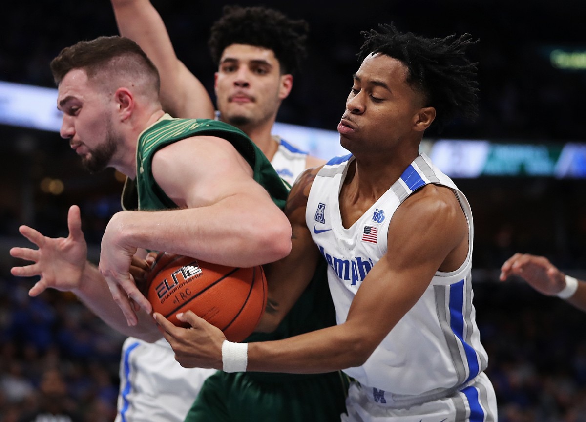 <strong>University of Memphis guard Tyler Harris steals the ball from under the arm of the Bulls' Antun Maricevic (left) during the Tigers' game on Feb. 8, 2020, against the University of South Florida at FedExForum in Memphis.</strong> (Jim Weber/Daily Memphian)
