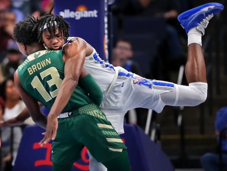 <strong>University of Memphis forward Precious Achiuwa (right) collides with the Bulls' Justin Brown during the Tigers' game on Feb. 8, 2020, against USF at FedExForum in Memphis.</strong> (Jim Weber/Daily Memphian)