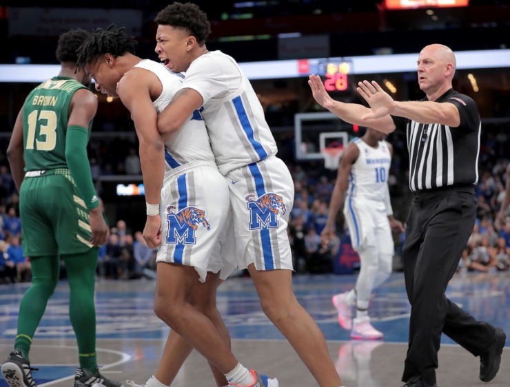 <strong>University of Memphis guards Tyler Harris (left) and Boogie Ellis react to a foul call during the Tigers' game on Feb. 8, 2020, against USF at FedExForum in Memphis.</strong> (Jim Weber/Daily Memphian)