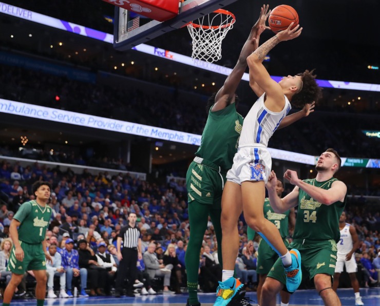 <strong>University of Memphis guard Lester Quinones shoots under pressure by the Bulls' Rashun Williams during the Tigers' game on Feb. 8, 2020, against USF at FedExForum in Memphis.</strong> (Jim Weber/Daily Memphian)