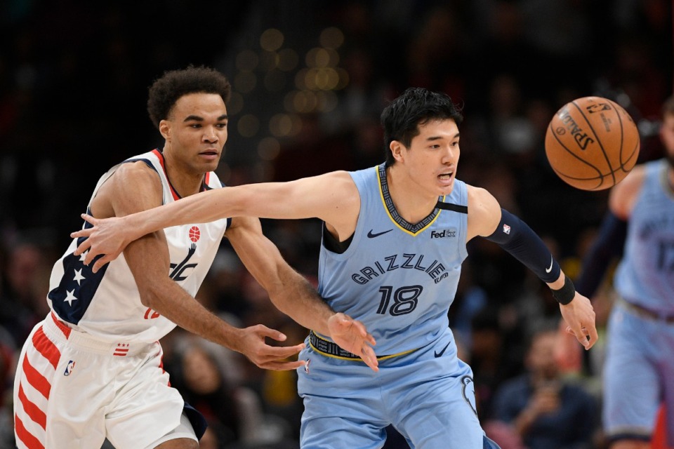 <strong>Memphis Grizzlies guard Yuta Watanabe (18) and Washington Wizards guard Jerome Robinson (left) battle for the ball during the first half of an NBA game on Feb. 9, 2020, in Washington.</strong> (AP Photo/Nick Wass)
