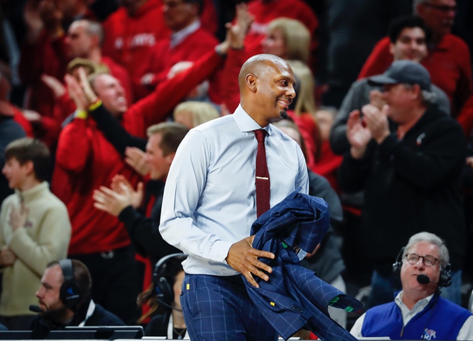<strong>Memphis head coach Penny Hardaway smiles while taking off his jacket after an official&rsquo;s foul call against the Tigers while playing Cincinnati Thursday, Feb. 13, 2020.</strong> (Mark Weber/Daily Memphian)