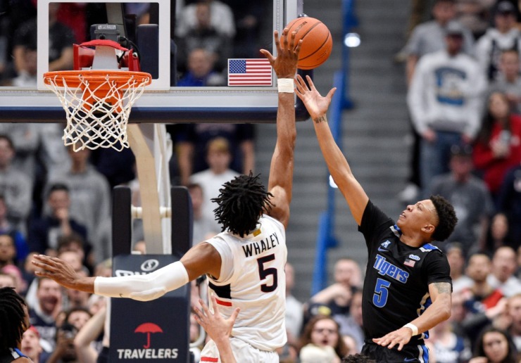 <strong>Connecticut's Isaiah Whaley, left, blocks a shot-attempt by Memphis' Boogie Ellis, right, in the second half of an NCAA college basketball game, Sunday, Feb. 16, 2020, in Hartford, Conn.</strong> (Jessica Hill/AP)