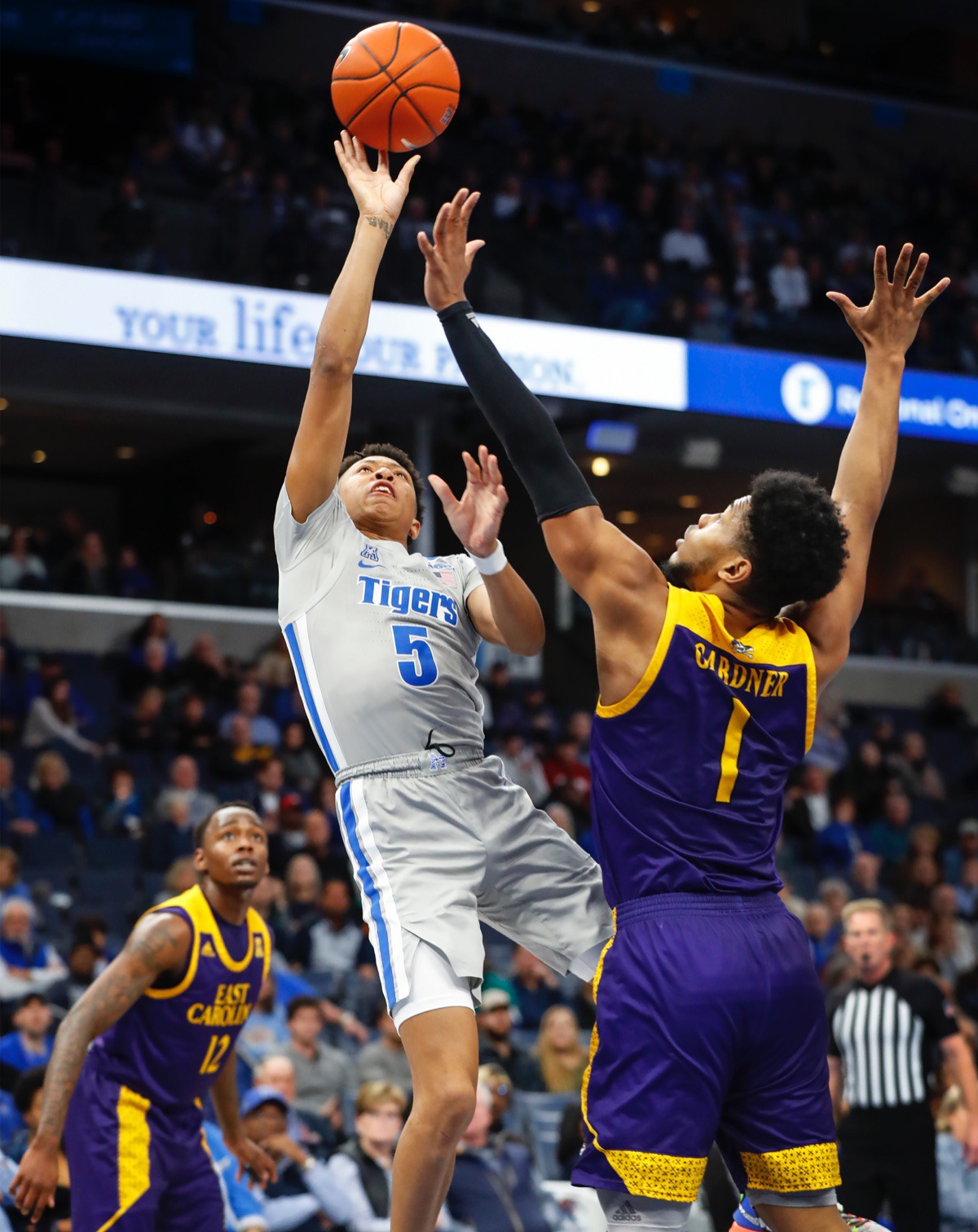 <strong>Memphis guard Boogie Ellis (left) drives to the basket against ECU's Jayden Gardner (right) Feb. 19, 2020, at FedExForum.</strong> (Mark Weber/Daily Memphian)