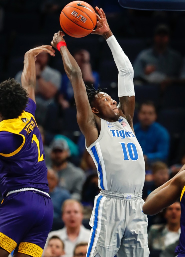 <strong>Memphis guard Damion Baugh (right) has the ball knocked out of his hands while driving to the basket against ECU's J.J. Miles (left) Feb. 19, 2020, at FedExForum.</strong> (Mark Weber/Daily Memphian)