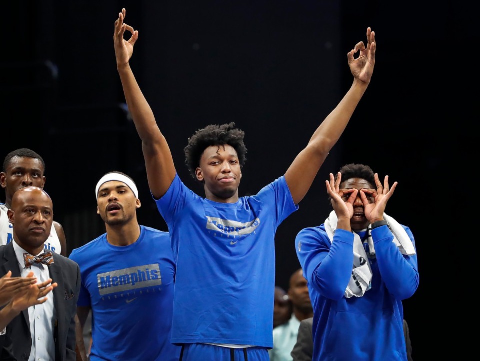<strong>James Wiseman (middle) celebrates a teammate's 3-pointer against Little Rock even while being suspended on&nbsp;Nov. 20, 2019, at FedExForum.</strong> (Mark Weber/Daily Memphian file)