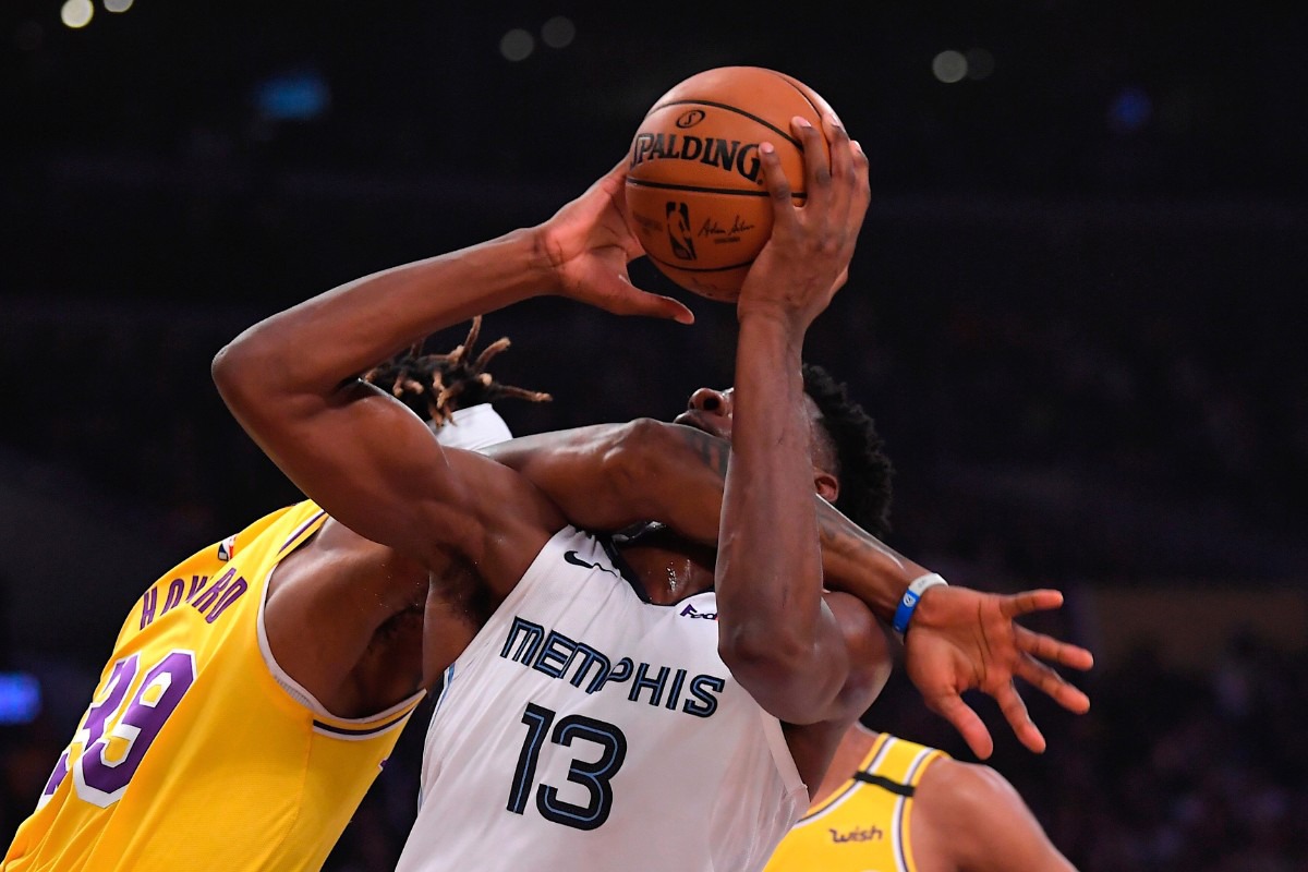 <strong>Los Angeles Lakers center Dwight Howard, left, fouls Memphis Grizzlies forward Jaren Jackson Jr. (13) in the act of shooting Feb. 21, 2020, in Los Angeles.</strong> (Mark J. Terrill/AP)