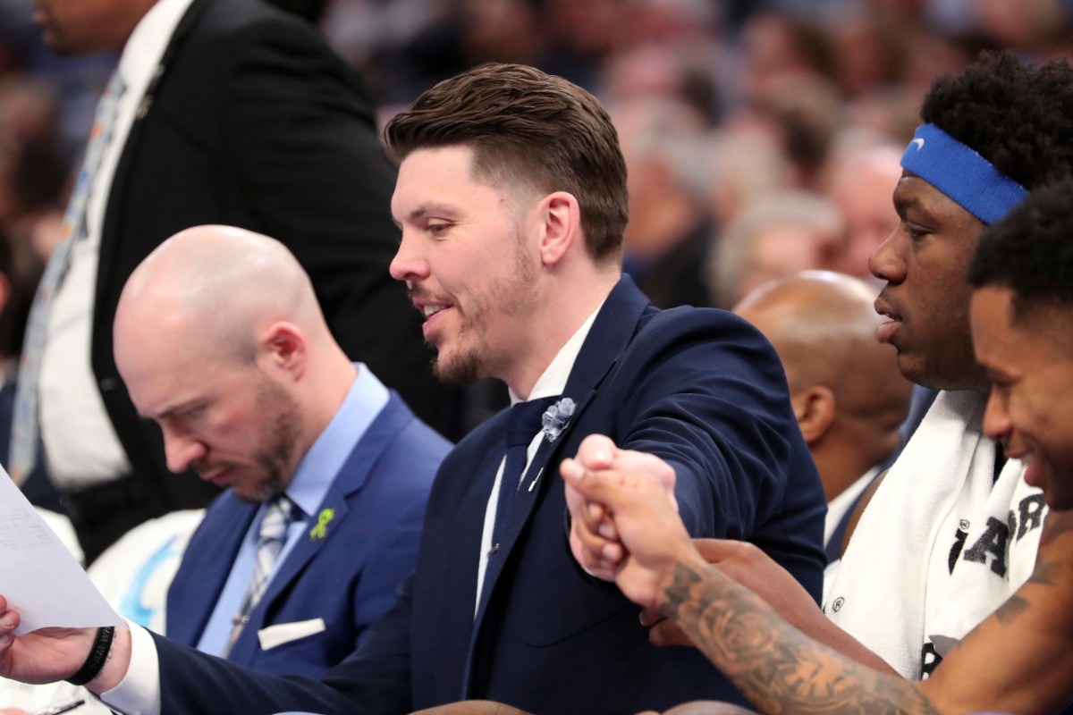 <strong>Memphis coach Mike Miller reaches out to player Tyler Harris (1) in the first half&nbsp;of the Tigers game against Houston on Feb. 22, 2020, in Memphis.</strong> (AP Photo/Karen Pulfer Focht)