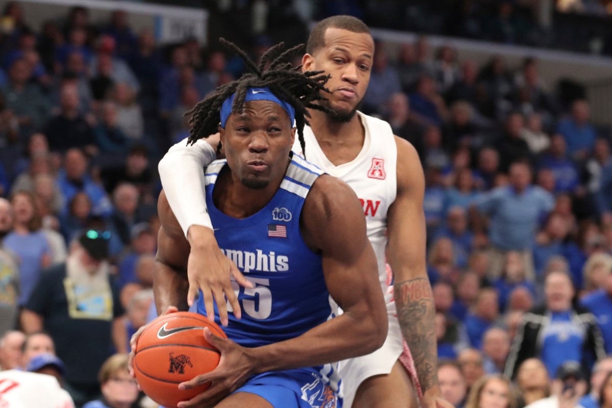 <strong>Memphis forward Precious Achiuwa (55) goes up for a basket as Houston forward Justin Gorham (4) defends in the second half&nbsp;of the Tigers game against Houston on Feb. 22, 2020, in Memphis.</strong> (AP Photo/Karen Pulfer Focht)