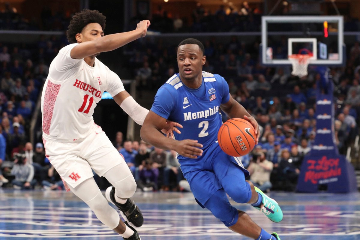 <strong>Memphis guard Alex Lomax (2) heads to the basket as Houston guard Nate Hinton defends in the second half&nbsp;of the Tigers game against Houston on Feb. 22, 2020, in Memphis. </strong>(AP Photo/Karen Pulfer Focht)