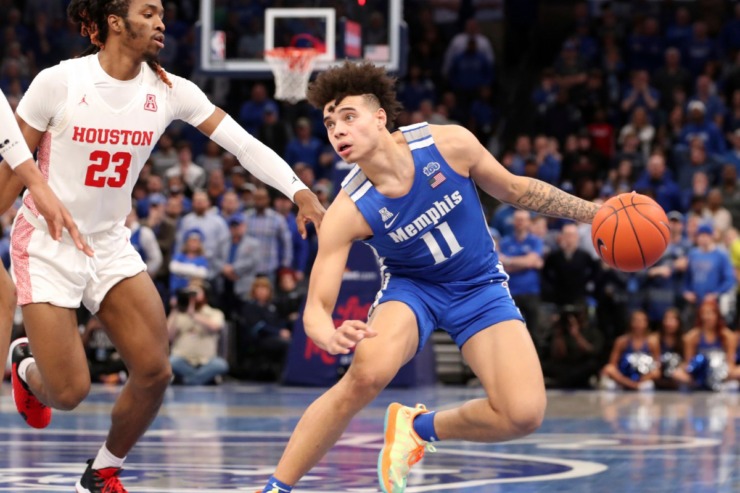 <strong>Memphis guard Lester Quinones (11) looks to shoot as Houston's Cedrick Alley Jr. (23) moves in during the second half&nbsp;of the Tigers game against Houston on Feb. 22, 2020, in Memphis. </strong>(AP Photo/Karen Pulfer Focht)
