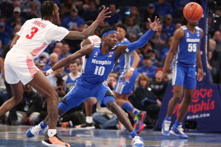 <strong>Memphis guard Damion Baugh (10) and Houston guard Dejon Jarreau (3) go for a loose ball in the second half&nbsp;of the Tigers game against Houston on Feb. 22, 2020, in Memphis. </strong>(AP Photo/Karen Pulfer Focht)