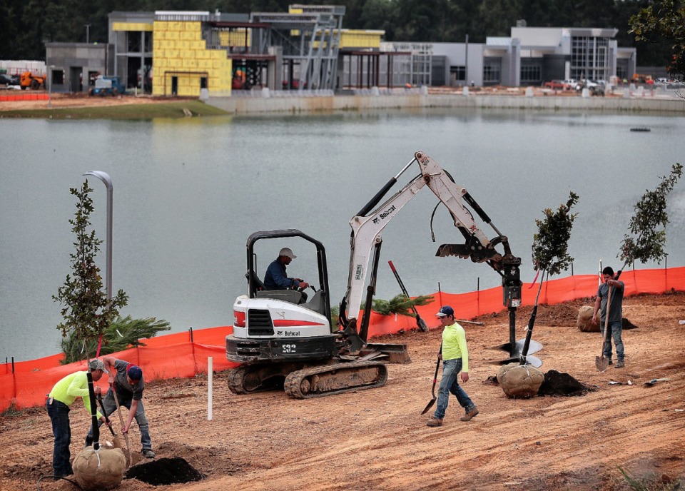 <strong>Construction crews work on landscaping near a new library and police precinct on Oct. 15, 2019, at the site of the old Raleigh Springs Mall.</strong>&nbsp; (Jim Weber/Daily Memphian file)