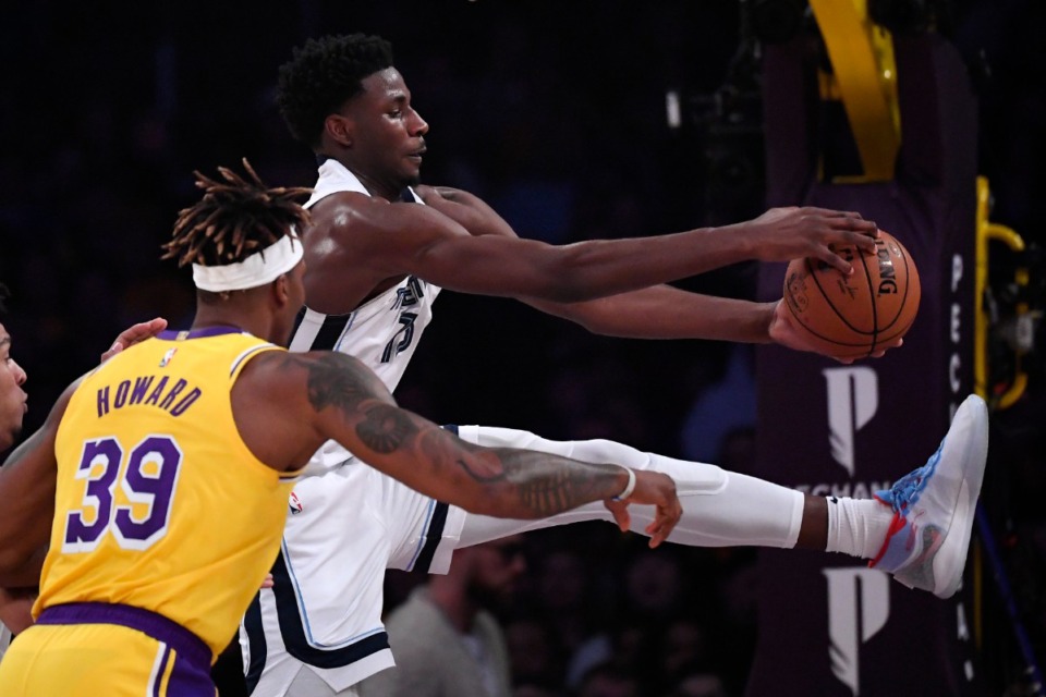 <strong>Memphis Grizzlies forward Jaren Jackson Jr., right, grabs a rebound away from Los Angeles Lakers center Dwight Howard during the first half of an NBA basketball game Friday, Feb. 21, 2020, in Los Angeles.</strong> (AP Photo/Mark J. Terrill)