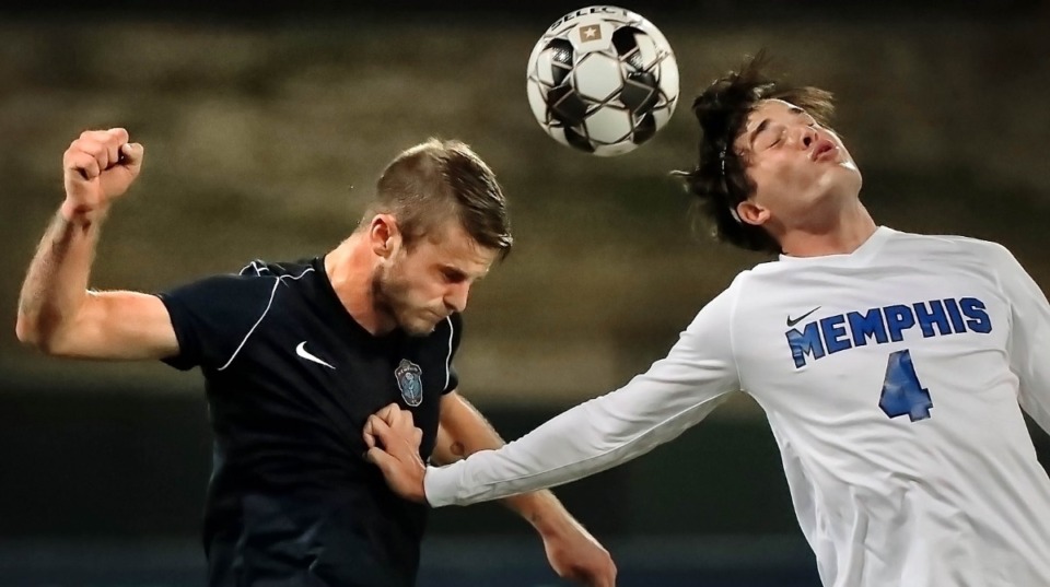 <strong>Memphis 901 FC defender Zach Carroll (3) battles for first touch with the Tigers' Artur De Luca (4) during 901 FC's preseason exhibition game against the University of Memphis at AutoZone Park on Feb. 29, 2020.</strong> (Jim Weber/Daily Memphian)