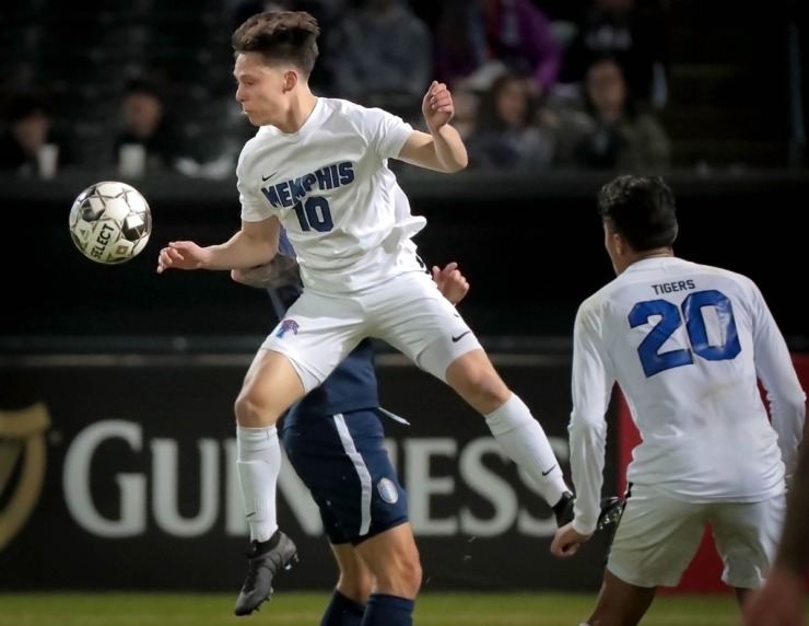 <strong>The Tigers' Jackson Peterson (10) controls a header during 901 FC's preseason exhibition game against the University of Memphis at AutoZone Park on Feb. 29, 2020.</strong> (Jim Weber/Daily Memphian)