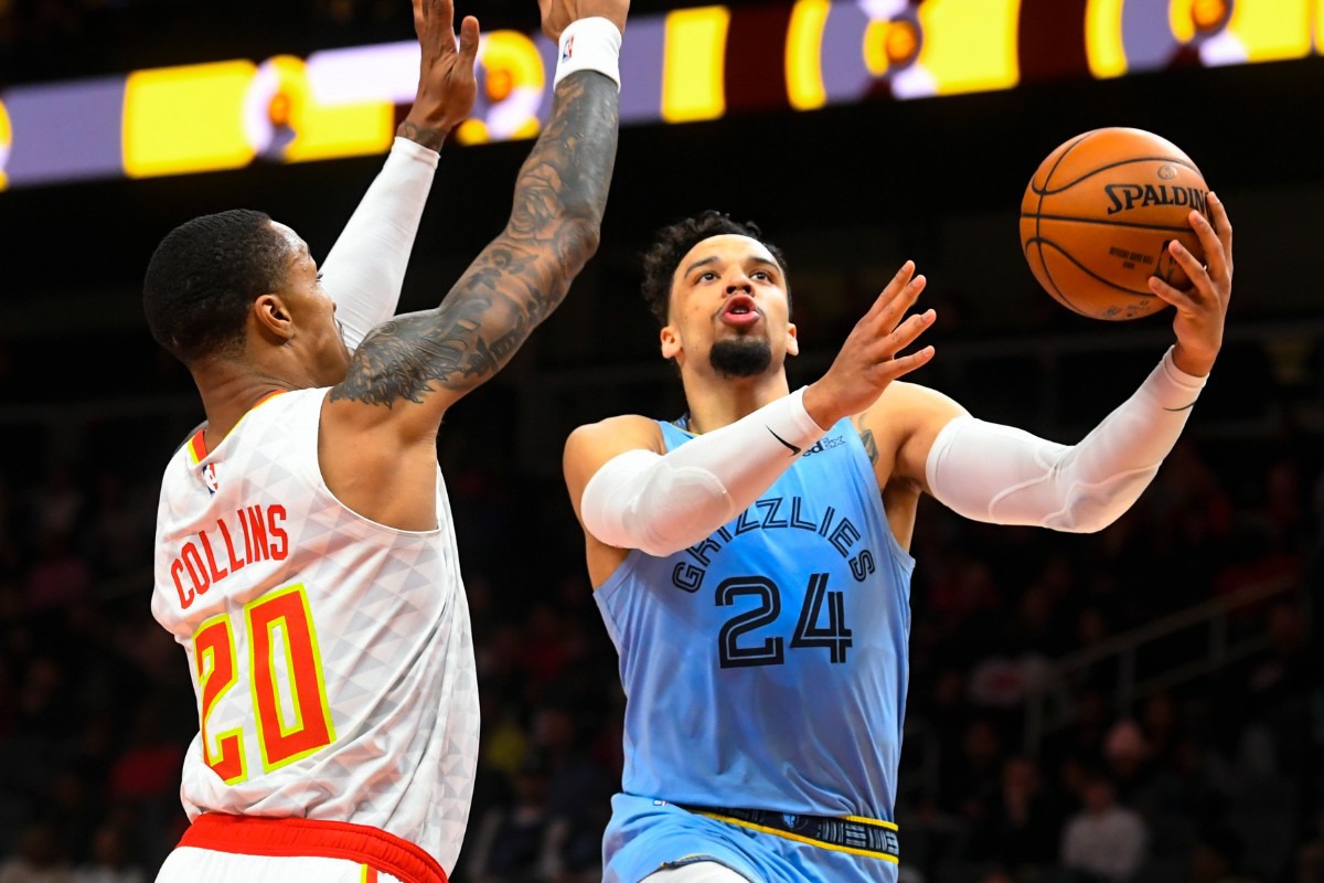 <strong>Memphis Grizzlies guard Dillon Brooks (24) shoots around Atlanta Hawks forward John Collins March 2, 2020, in Atlanta.</strong> (John Amis/AP)