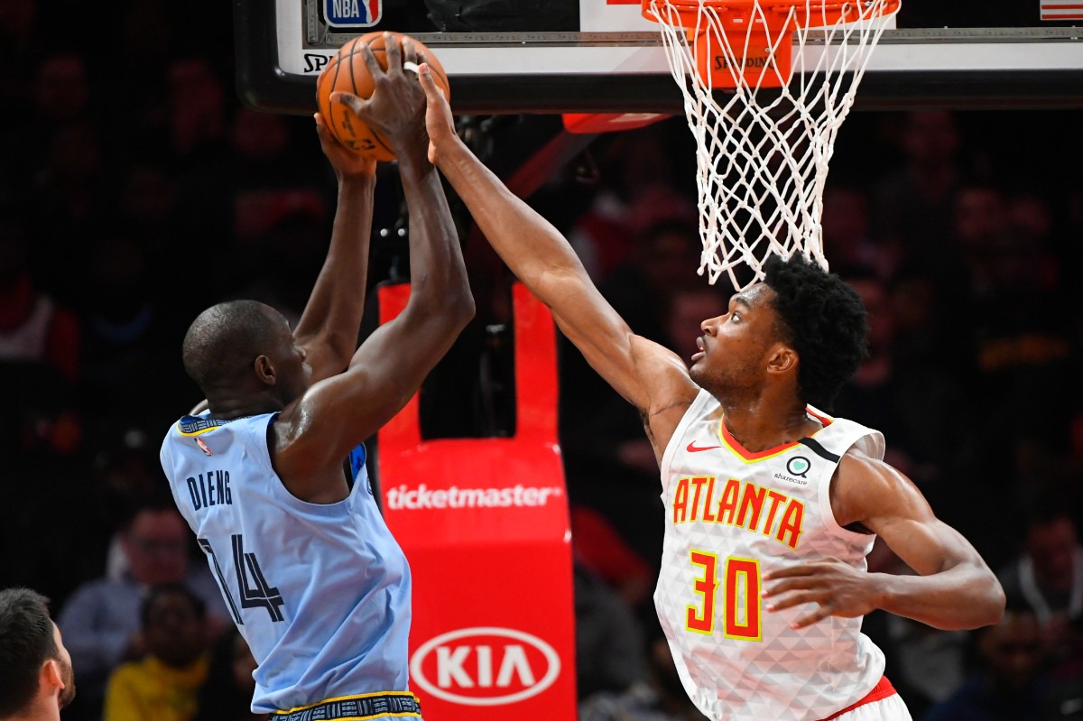 <strong>Atlanta Hawks center Damian Jones (30) tries to block Memphis Grizzlies center Gorgui Dieng March 2, 2020, in Atlanta.</strong>&nbsp;(John Amis/AP)