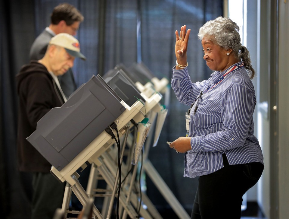 <strong>Poll worker Denetria Cooperidge (right) greets voters at the Mississippi Blvd. Christian Church polling location as voters go to the polls on March 3, 2020, to vote in the Super Tuesday primaries.</strong> (Jim Weber/Daily Memphian)