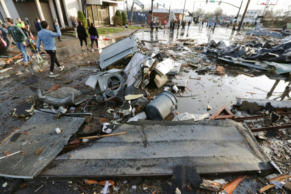 <strong>Debris covers a street after overnight storms Tuesday, March 3, 2020, in Nashville, Tennessee. Tornadoes ripped across Tennessee early Tuesday, shredding buildings and killing multiple people.</strong> (AP Photo/Mark Humphrey)