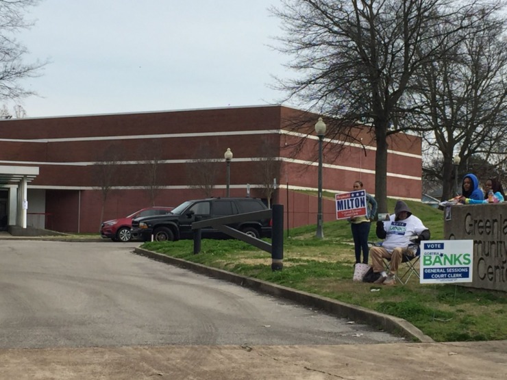 <strong>There were four campaign workers stationed along the poll&rsquo;s entry drive at Greenlaw Community Center, all of them waving signs for General Sessions Court Clerk candidates.</strong> (Wayne Risher/Daily Memphian)