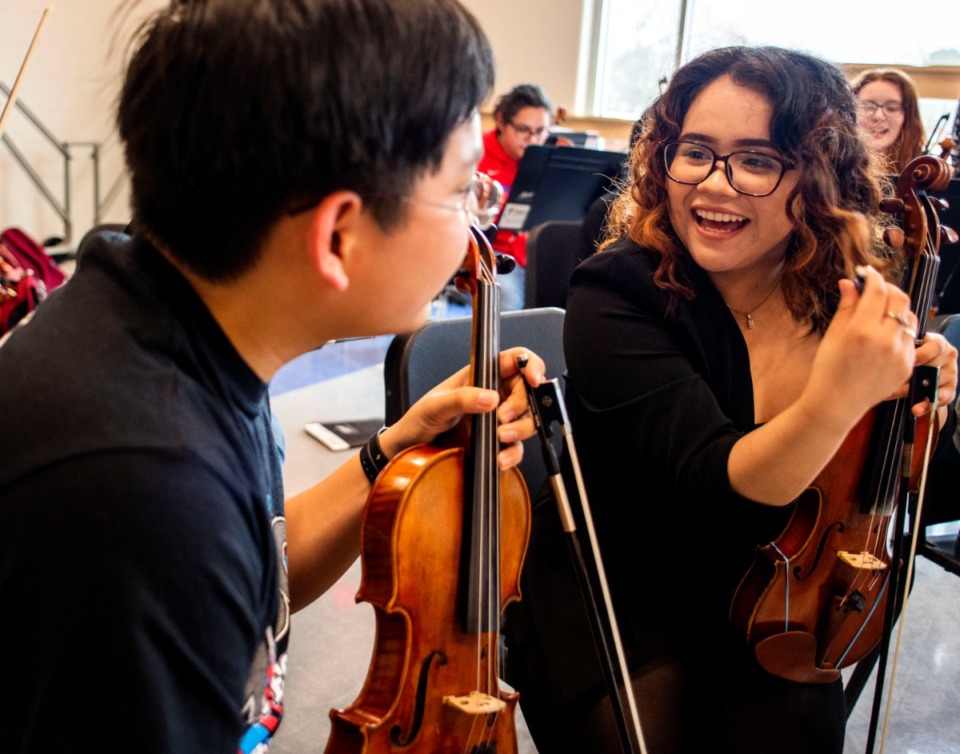 <strong>Maren Lopez (right), a junior at Barlett High School, talks through musical scores with her sophmore classmate Timothy Lock (left). Bartlett High School is in the final stages of construction and has already completed the band classroom</strong>. (Houston Cofield/Special To The Daily Memphian)