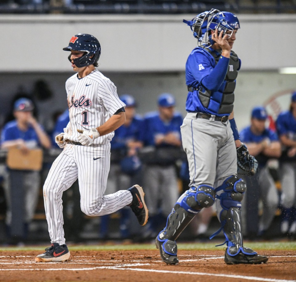 <strong>Ole Miss&rsquo; Peyton Chatagnier (1) scores behind Memphis catcher Hunter Goodman (35) at Oxford-University Stadium in Oxford, Miss., on Tuesday, March 3, 2020.</strong> (Bruce Newman/Special to The Daily Memphian)