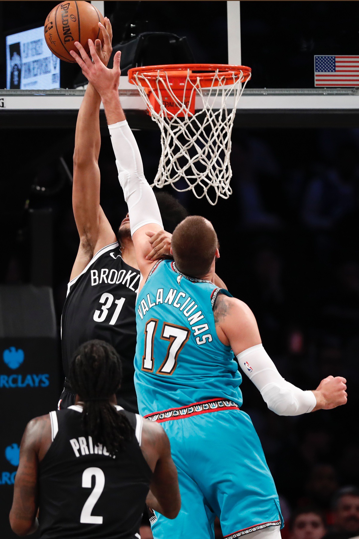 <strong>Brooklyn Nets center Jarrett Allen (31) grabs the shooting arm of Memphis Grizzlies center Jonas Valanciunas (17) and fouls him March 4, 2020, in New York. Brooklyn Nets forward Taurean Prince (2) watches from the floor, lower left.</strong> (Kathy Willens/AP)