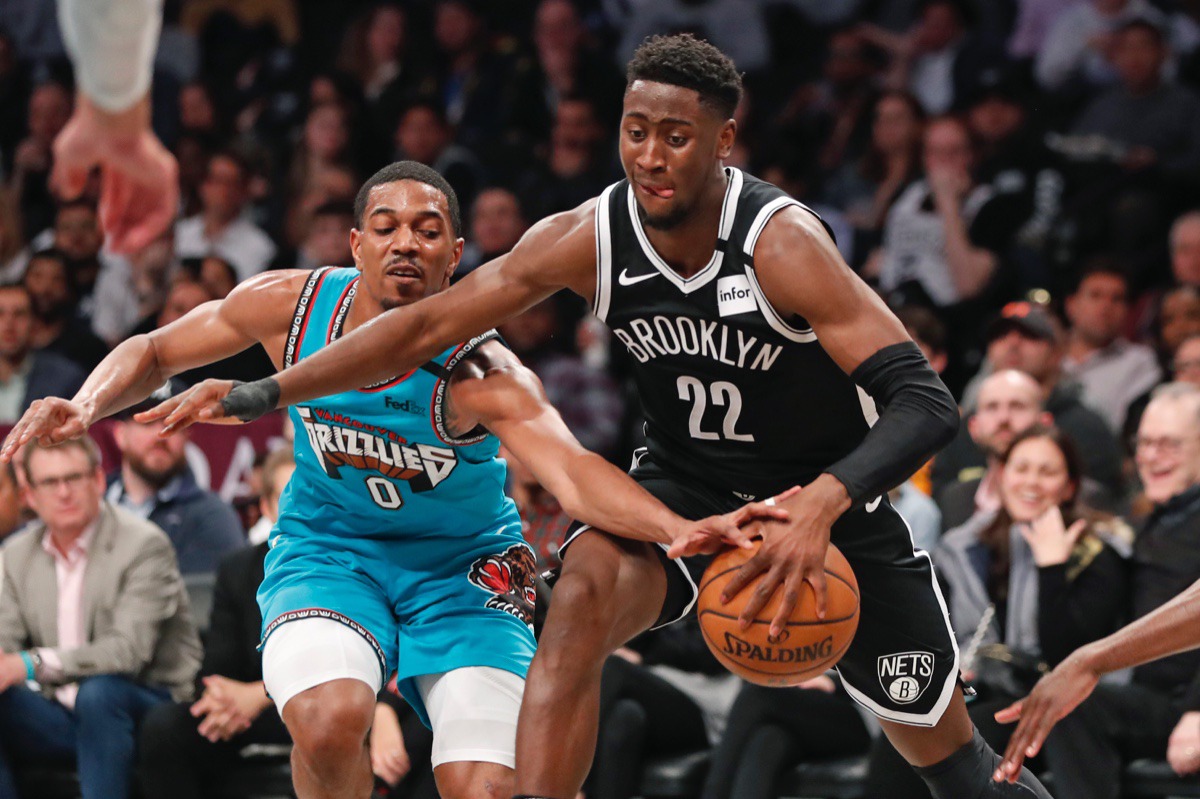 <strong>Memphis Grizzlies guard De'Anthony Melton (0) tries to strip the ball from Brooklyn Nets guard Caris LeVert (22) as LeVert drives to the basket March 4, 2020, in New York.</strong> (Kathy Willens/AP)