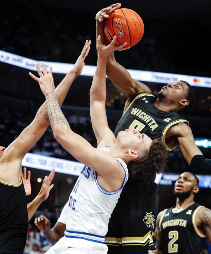 <strong>Memphis guard Lester Quinones (bottom) is fouled while driving the lane against Wichita State's Trey Wade (top) March 5, 2020, at FedExForum.</strong> (Mark Weber/Daily Memphian)