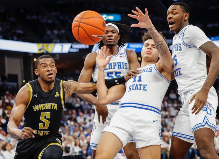 <strong>Wichita State guard Trey Wade (left) is called for a foul after pushing Lester Quinones (middle right) March 5, 2020, at FedExForum.</strong> (Mark Weber/Daily Memphian)