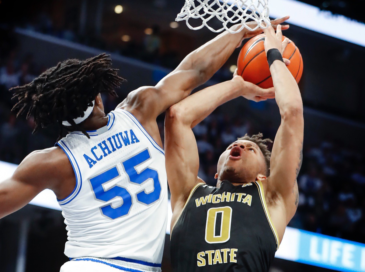 <strong>Memphis defender Precious Achiuwa (left) blocks Wichita State guard Dexter Dennis (right) March 5, 2020, at FedExForum.</strong> (Mark Weber/Daily Memphian)